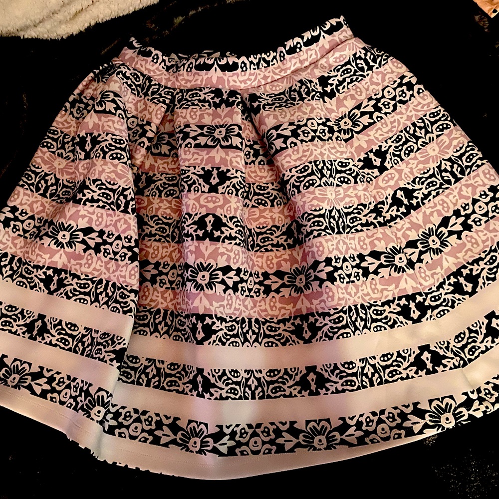 A skirt with beautiful colors. Very comfortable. Length right above knees